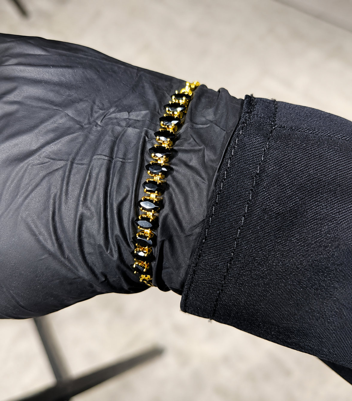 Beautiful Adjustable Black Gold Bracelet flat lay