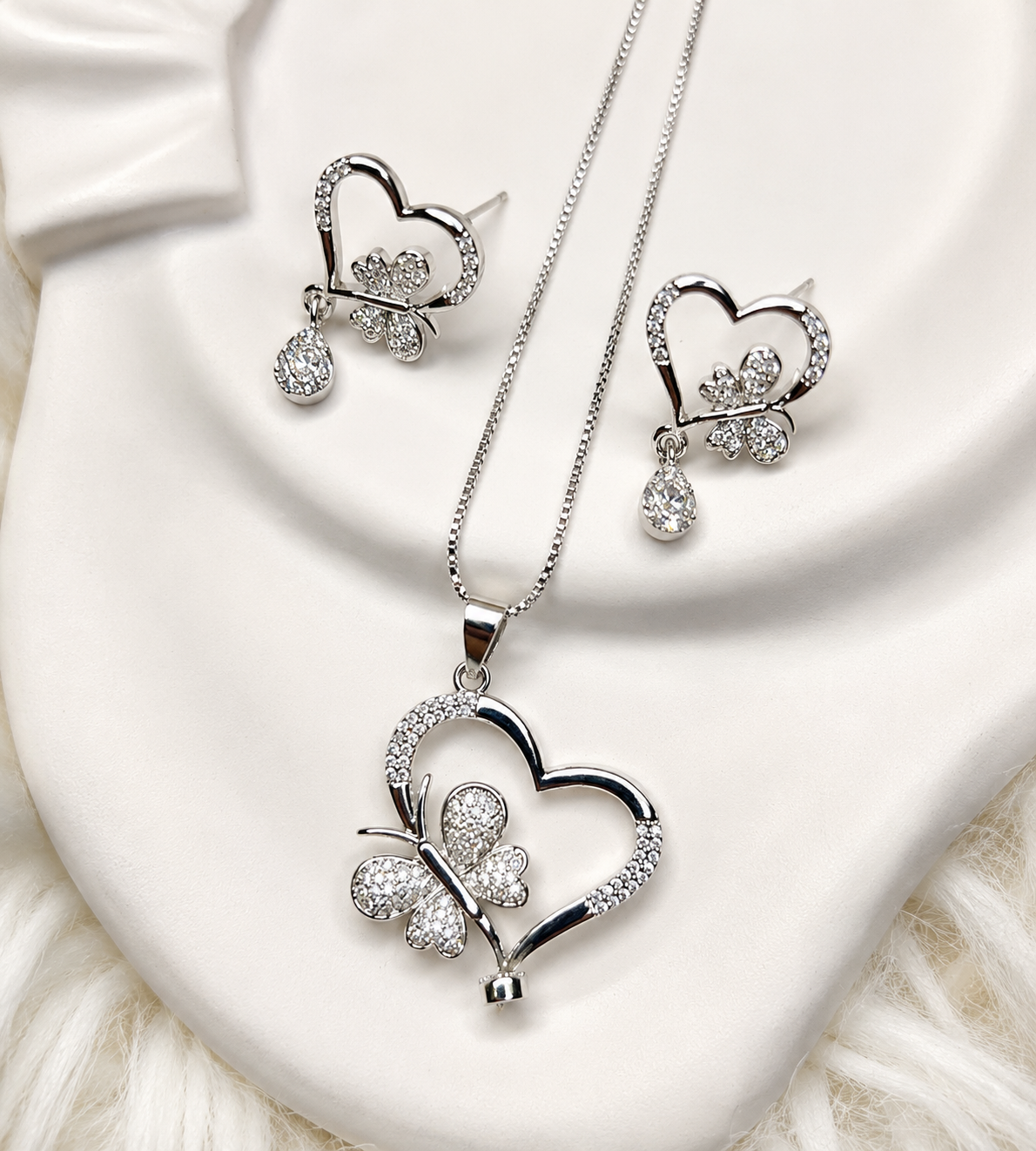 Butterfly Heart Pendant Earrings Silver Set flat lay
